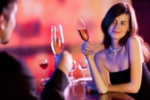 Couple on romantic date or celebrating together at restaurant