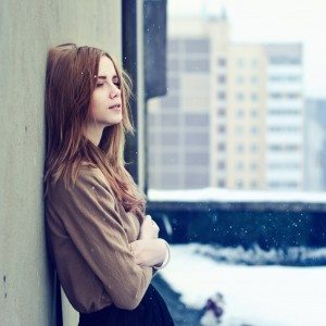 young teen girl on the roof of the winter freeze