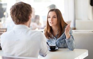 Young couple arguing in a cafe. Relationship problems.