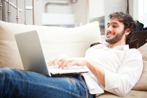 Man using a laptop in his apartment