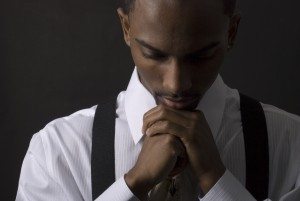 African American businessman is thinking intensely