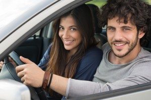 Smiling Couple Traveling By Car