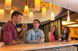 Photo of joyful friends in the bar communicating with each other