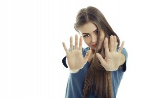 Woman making stop gesture with both her hands