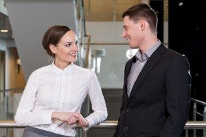 Businesswoman flirting with her workmate