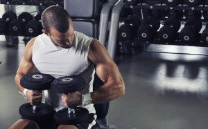 Handsome Muscular Male Model Posing With Dumbbells