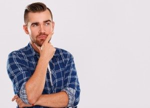 Emotions. Young man in blue shirt