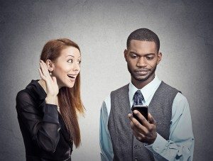 Man obsessed with smartphone ignoring woman