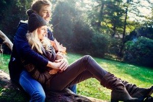 smiling couple with autumn background