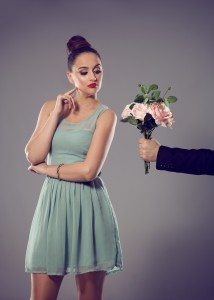 Uninterested female, man giving a bunch of flowers