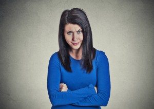 portrait skeptic doubtful woman looking at you camera