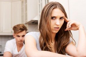 Couple having an argument in the kitchen.