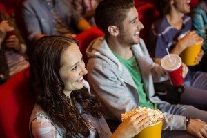 Young friends watching a film