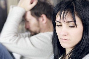 Sad woman not looking upset husband