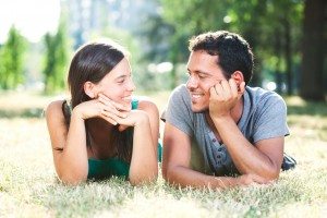 Happy couple enjoying their time in park on a summer day