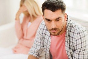 unhappy couple having argument at home