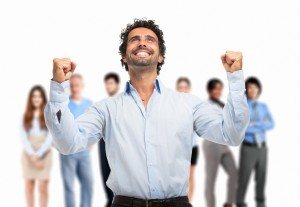 Very happy man in front of a group of people