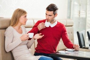 Young couple talking in a cafe