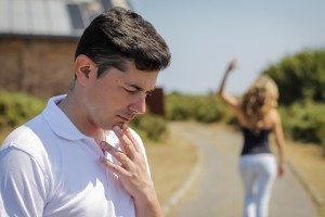 Unhappy man and angry woman leaving after quarrel