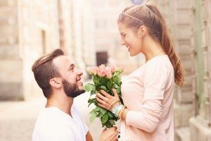 Romantic couple getting engaged in the city