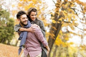 Young couple in the autumn forest