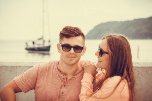 Smiling couple at sea