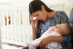 Tired Mother Suffering From Post Natal Depression