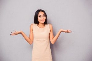 Portrait of a woman shrugging shoulders